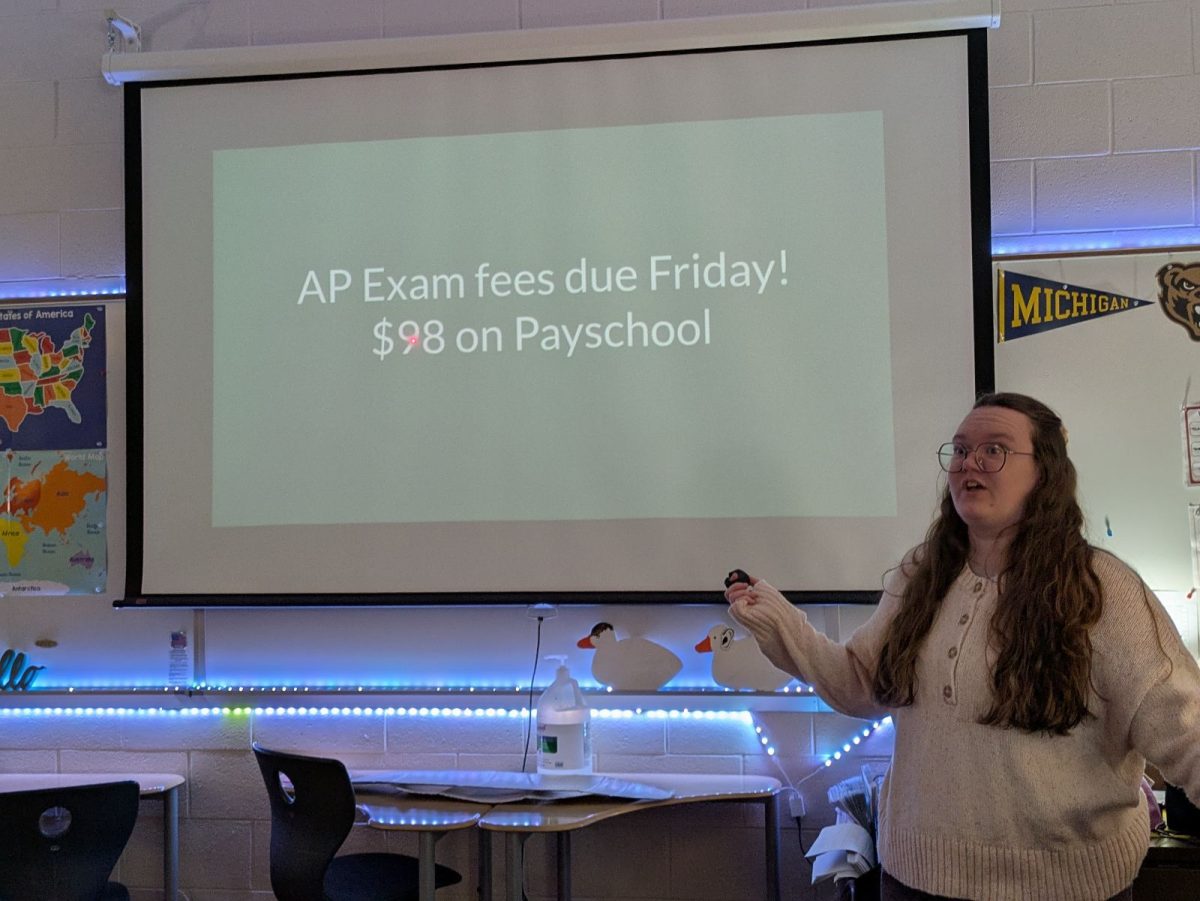 A staged photo of Ms. Johnson reminding her AP Government students of their AP exam fee due date. (Summer Stratton || Beneath the Stripes)