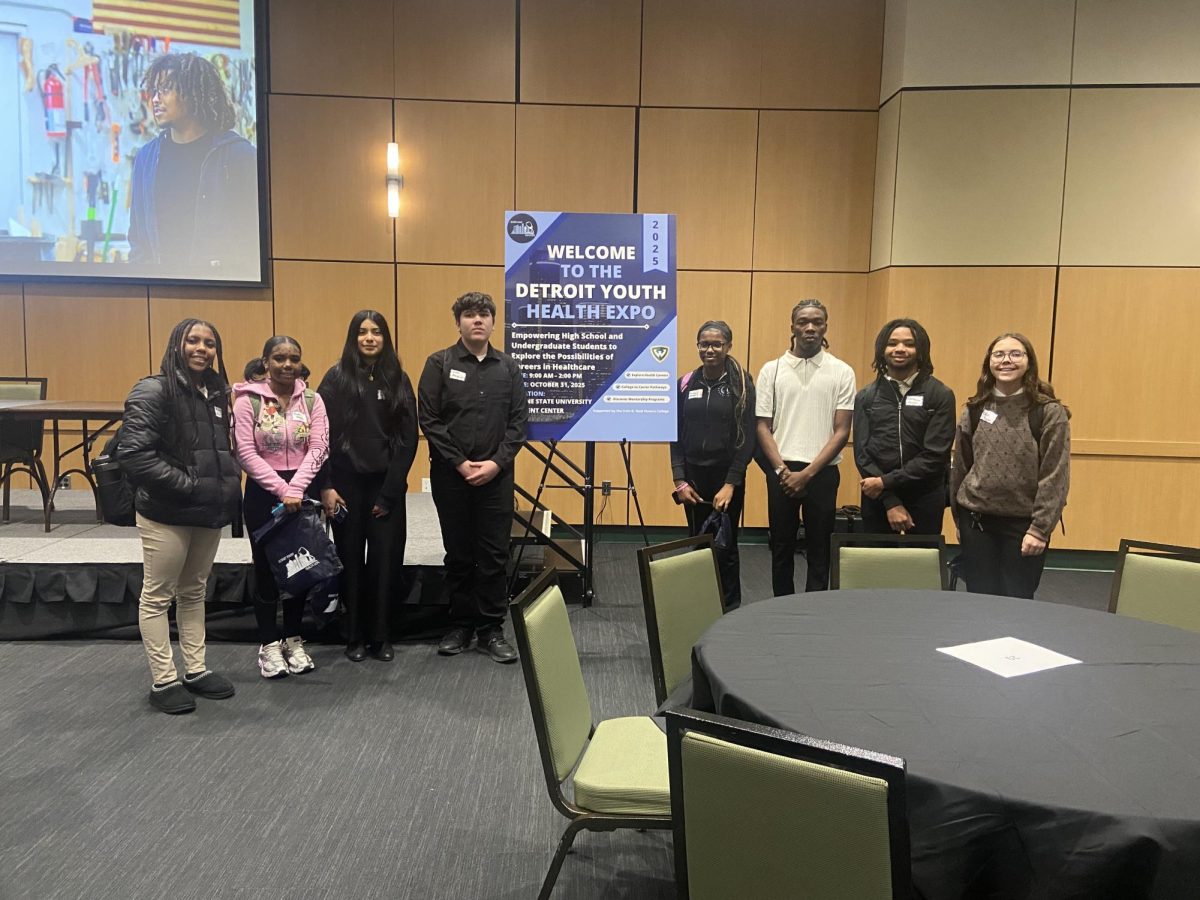  Belleville High School students: Jourdyn Brooks-Pride, NaShawn Howard, Miranda Phelps, Jocelyn Quiroz-Aguilar, Quentin Stebbins, Elliot Taylor, and Kimora Thorngren are all smiles standing by the WSU Youth Health Expo's welcome sign. 