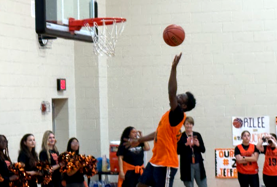 Senior, Shawn Pape, scores in the Senior Night basketball game at Belleville High School where the Unified team took on Franklin Livonia.
