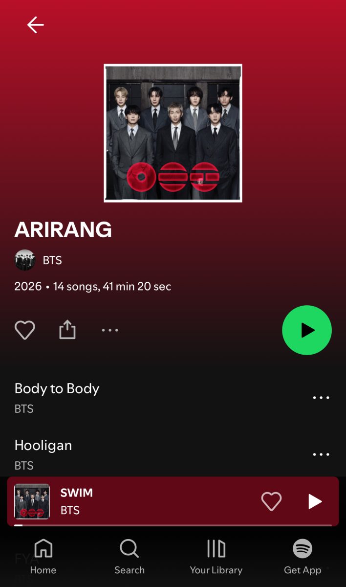 A student listens to new Music from BTS following the group's recent comeback.
